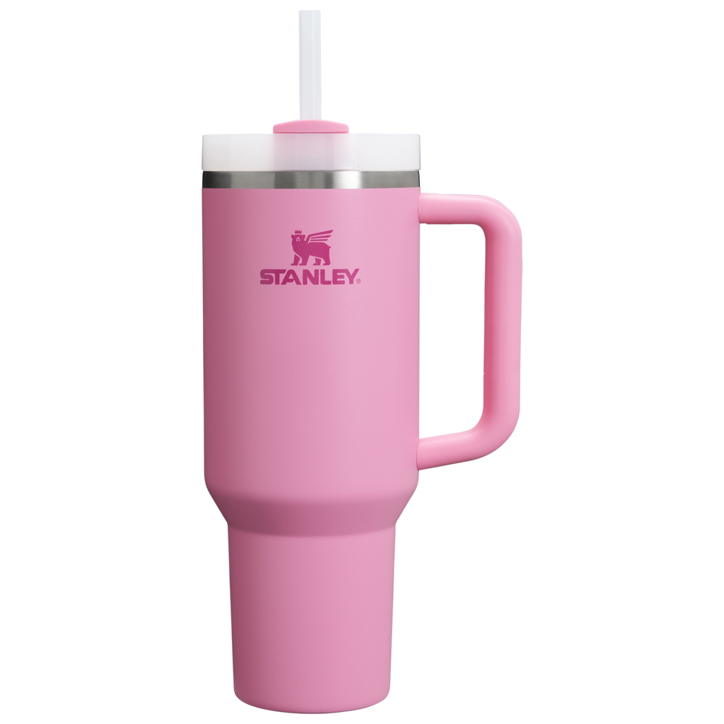 Stanley 1913 Quencher H2.0 tumbler in pink with handle, white lid, and straw on white background